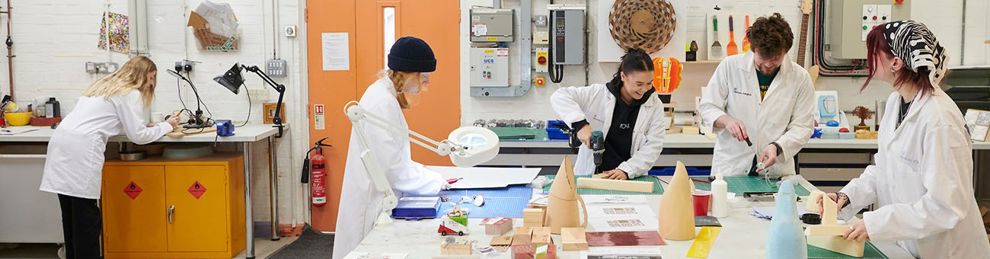 Group of students around a table making models