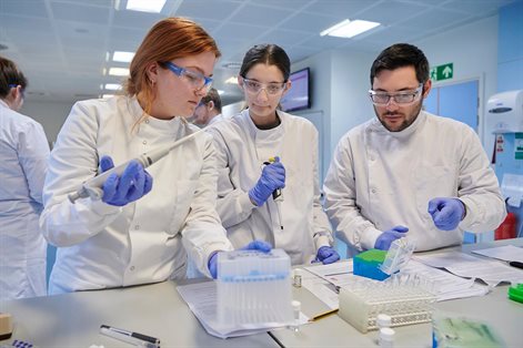 Three students testing plasma samples in biomedical science lab 2022