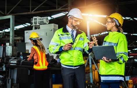 Students on a working site in high vis vest, safety glasses and hard hat