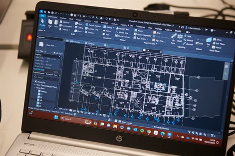 Open laptop displaying Building Information Modelling software on the screen