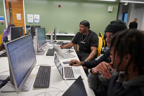 Group of students working at computers using Building Information Modelling software