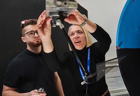 Engineering student and lecturer carrying out an experiment in the wind tunnel