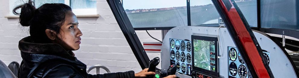 Female student in aircraft simulator