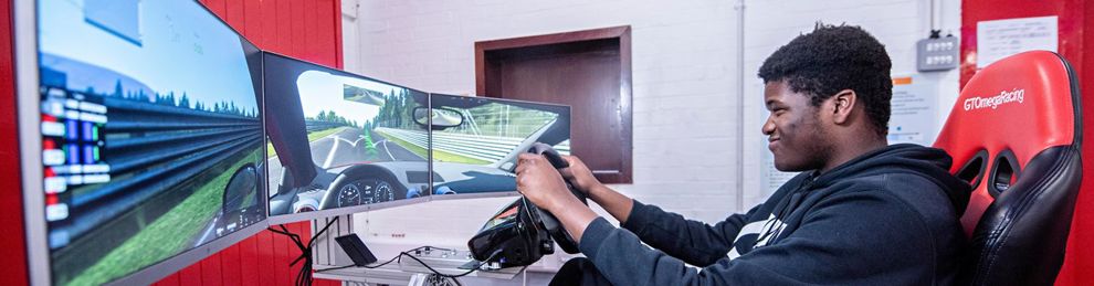 Student driving in car simulator