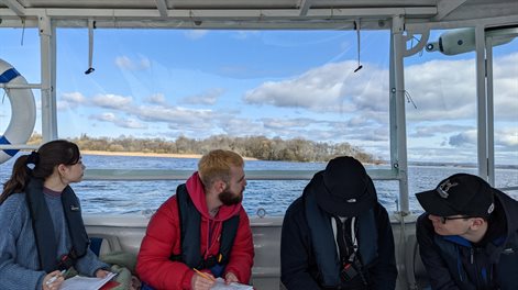 Four students on a boat in Northern Ireland