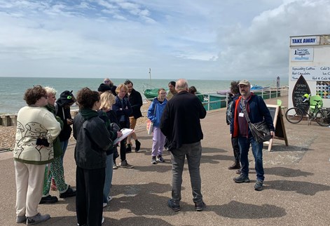 Group of geography and environment students on the seafront at Bexhill