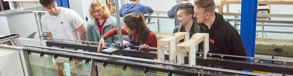 Students and lecturer working with the flume