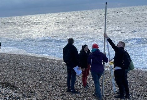 Students carrying out fieldwork at the beach