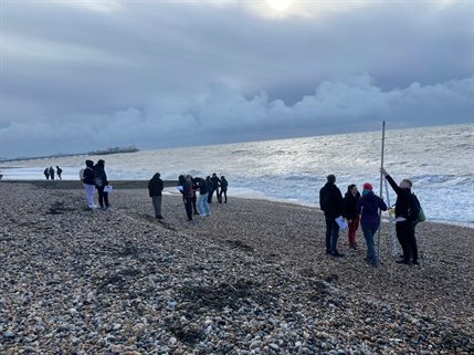Students carrying out fieldwork at the beach