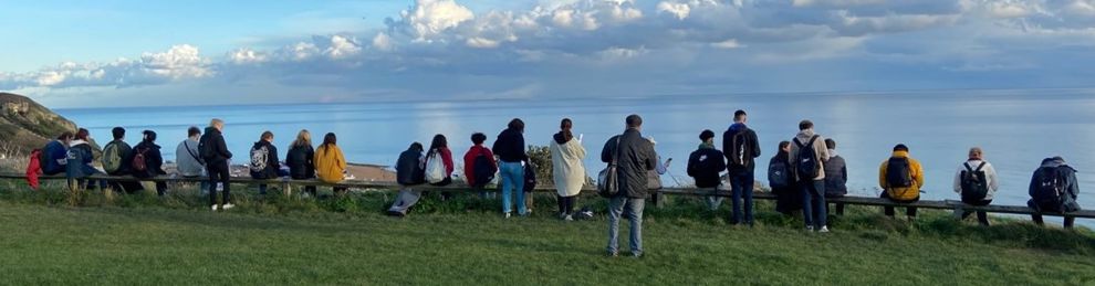 Students sketching Hastings from above