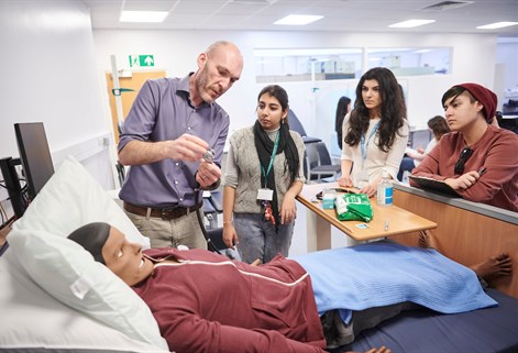 students and staff working in simulation suite