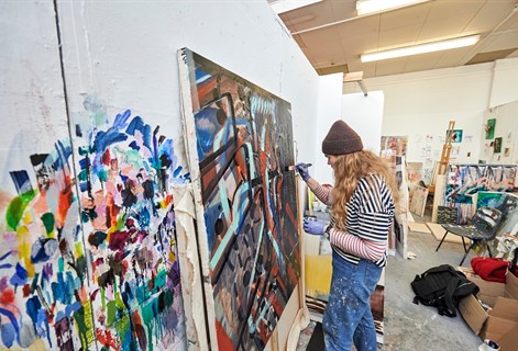 Painting student in uni studio