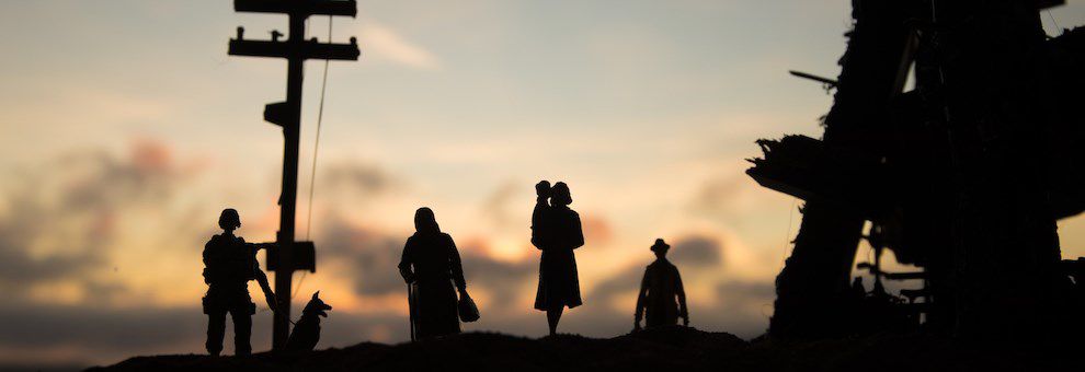 Silhouettes of people against the sky