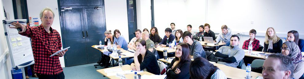 A business seminar with a lecturer and attentive students