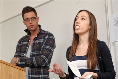 Two students delivering a talk