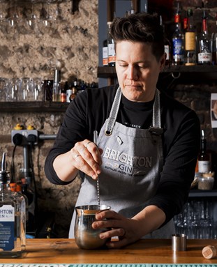 Charly Thieme from Brighton Gin making a drink at a bar