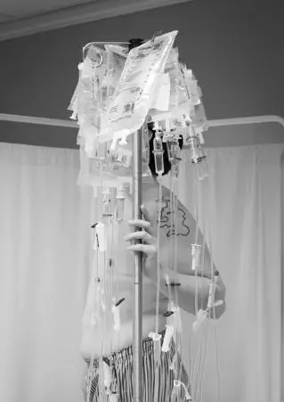 Anna Warin - Man poses with hospital infusions