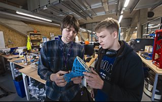 Students with a 3D printed object
