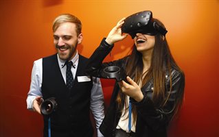 Two people with a VR headset