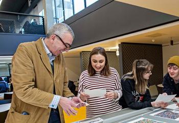 Art and media students working with lecturers
