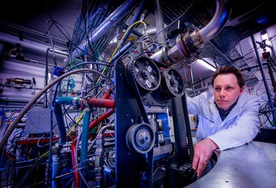 Engineer in a white coat at work in the lab