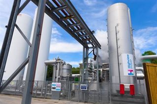 CRYOBattery™ tank graphic showing huge silver silo with gantry and fencing. Brand shows Highview logos. CRYOBattery tank from collaborations with the University of Brighton Advanced Engineering Centre.