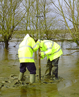 Researchers working on sediment coring in the intertidal area of Medmerry Nature Reserve