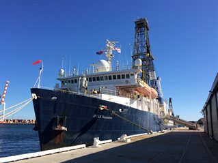 Large ocean-going vessel in port against blue sky. The JOIDES Resolution in Australia.