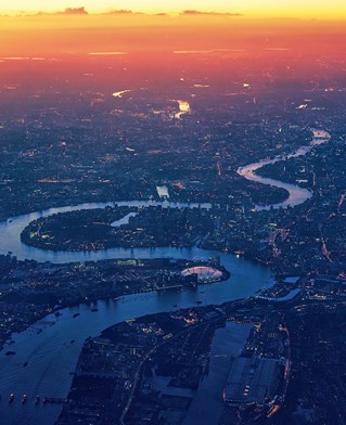 City of London from the air at dawn, showing the route of the Thames through the urban landscape Courtesy of J Plenio from Pixabay