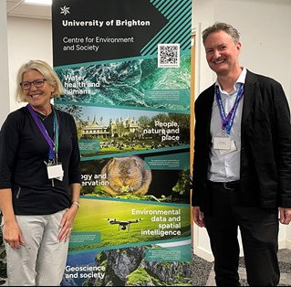 Dr Corina Ciocan and Professor James Ebdon standing next to the Centre for Environment and Society banner at launch event