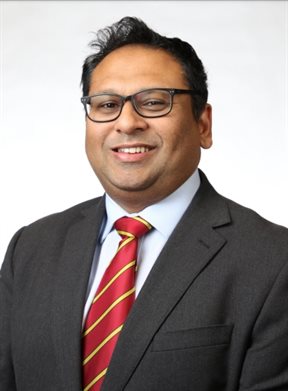 Head and shoulders portrait in suit of Professor Rameen Shakur