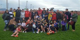 Large group of children of different ages gather n Mosquera, Colombia, participants in Football 4 Peace.