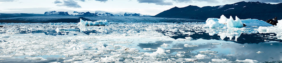Illustrating research into environmental communication, the banner photograph shows polar ice on water with bare and snow-capped mountains in the background