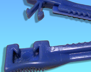A blue plastic umbilical cord clamp.