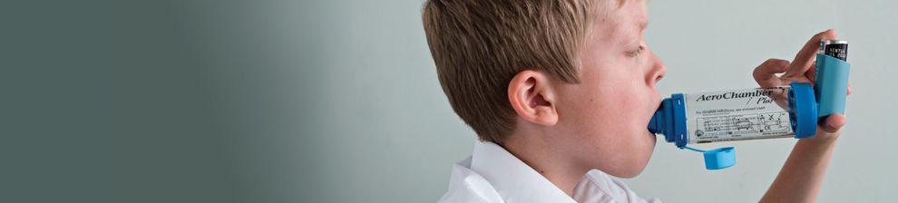 Child using asthma inhaler illustrating asthma research from Brighton and Sussex Medical School