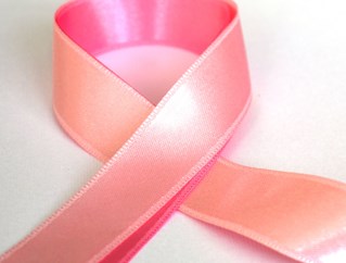 A pink ribbon, looped in the shape for the iconographic support symbol for breast cancer sufferers.