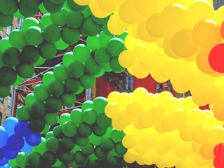 Pride ballons in rainbow colours at Pride celebration, courtesy of Gagnonm and Pixabay