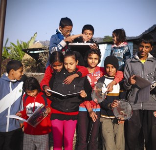 Eight young people in Nepal pose for the camera