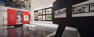 The Wolfsonian Florida International University. Main gallery for Julius Klinger: Posters for a Modern Age co-curated by Jeremy Aynsley. Large white walls with stone grey floor. Display boards and islands.