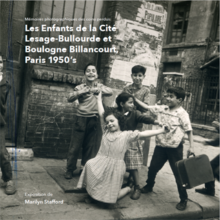 Square book cover of "Les Enfants de la Cite... Paris 1950s",  with black and white photograph of a group of young smiling children holding hands. In front a little girl rests on one knee, behind her a boy holds up two fingers. They are on a rundown stree
