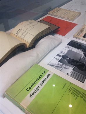 A gallery display vitrine with books related to design including, in foreground, a green paperback, Conference on Design Methods. From the exhibition Design Research and Its Participants curated by Lesley Whitworth.