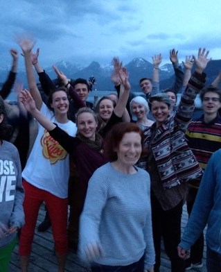 Close up of young people on climate retreat mountains and lake in background. St Gilgen, Austria.