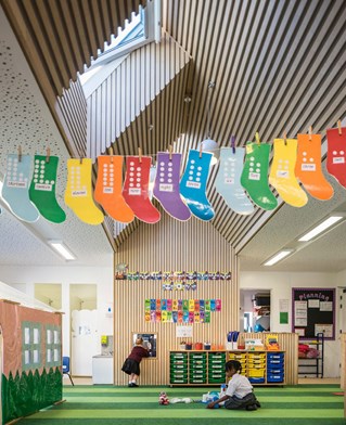 Large open school room with high ceiling natural light and space to play. Created by Nick Hayhurst and co, architects