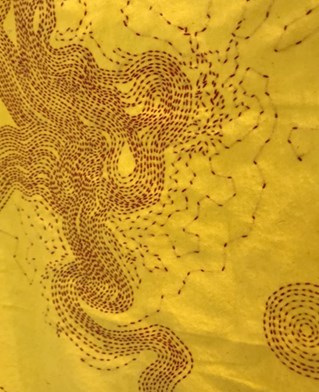 Traditional yellow duster with red thread tapestry design in swirling pattern and geometric circles. Work by Vanessa Marr.
