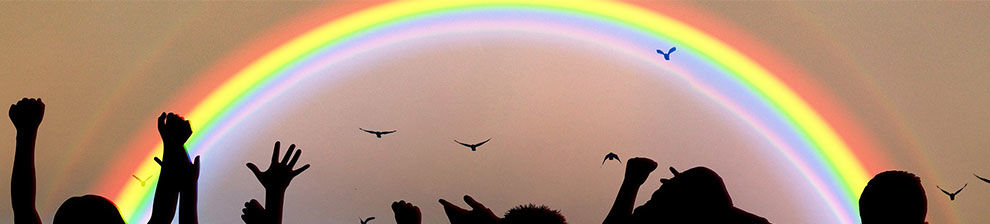 Rainbow with hands reaching up to the sky