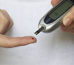 Blood sugar test being conducted on a patients finger