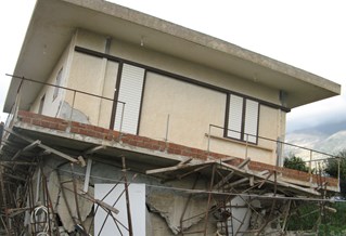 Falling house illustrating Sustainability and Resilience Engineering Research and Enterprise Group