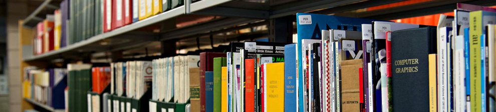 Research Journals on the shelf in a library.