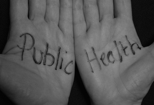 Two hands with the words 'Public' and 'Health' written across them