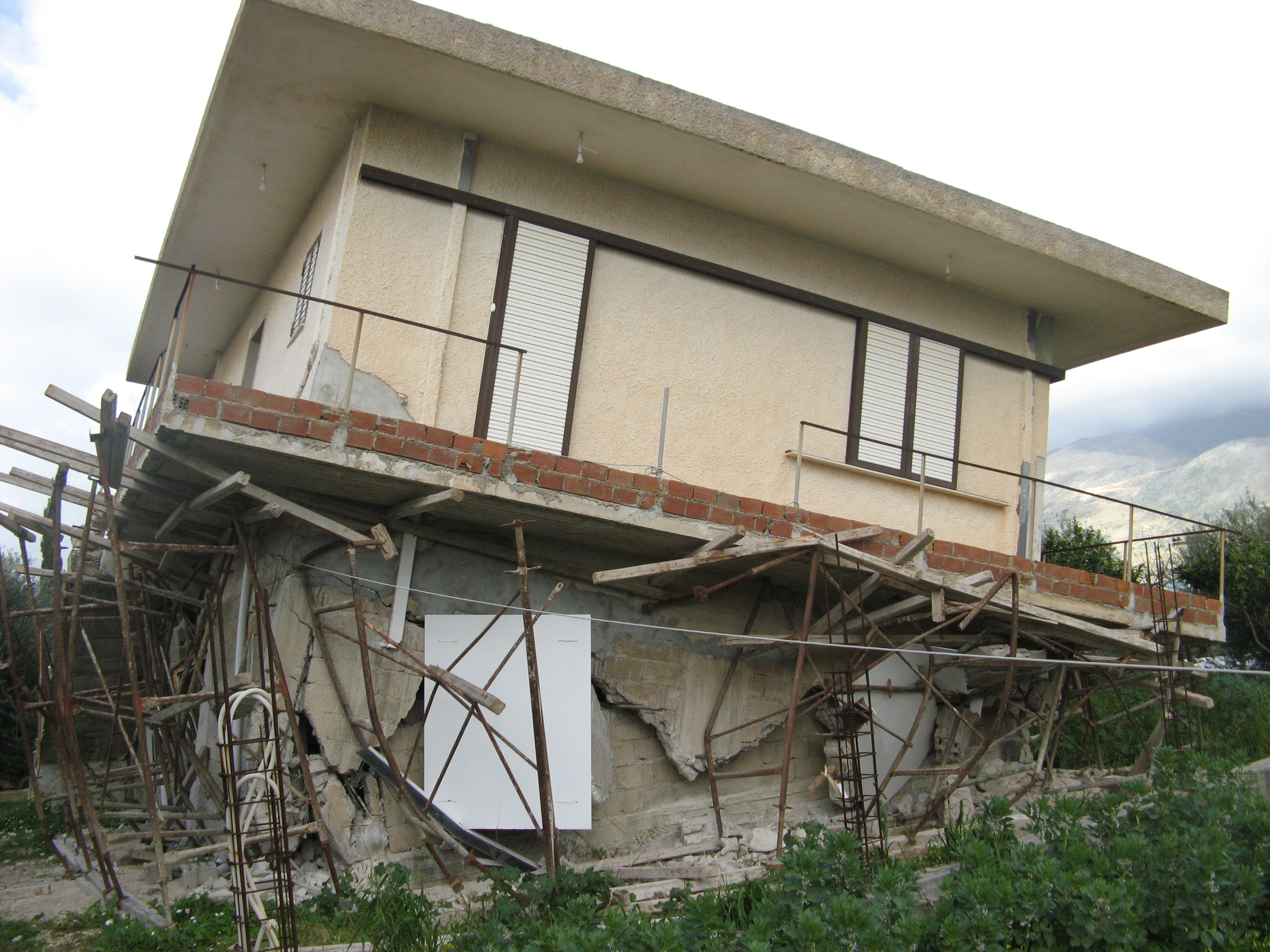 Falling house illustrating Sustainability and Resilience Engineering Research and Enterprise Group